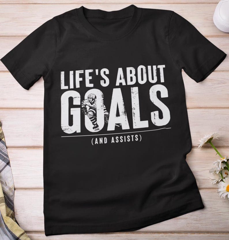 Hockey T-Shirt, Life's About Goals And Assists Hockey Players Lovers Sports Supporters Hockey Sticks Hockey Fans Women Men T-ShirtHockey T-Shirt, Life's About Goals And Assists Hockey Players Lovers Sports Supporters Hockey Sticks Hockey Fans Women Men T-Shirt