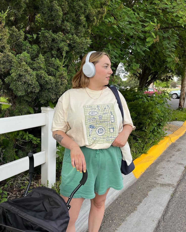 harry styles graphic tee, green shorts, casual style