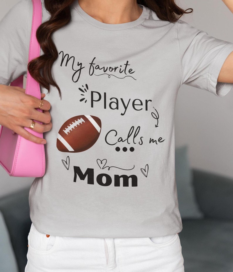 Football Mom T-Shirt, Sports Mom Tee, My Favorite Player Calls Me Mom Shirt, Football Fan Gift, Heart Design TeeFootball Mom T-Shirt, Sports Mom Tee, My Favorite Player Calls Me Mom Shirt, Football Fan Gift, Heart Design Tee