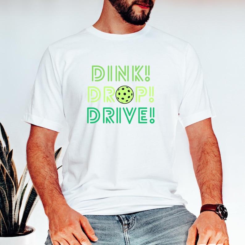 Dink Drop Drive T-Shirt, Pickle Ball T-shirt, Pickleball Dink Shirts, Workout Tee Shirt, Pickleball Lover Tees With Neck LabelDink Drop Drive T-Shirt, Pickle Ball T-shirt, Pickleball Dink Shirts, Workout Tee Shirt, Pickleball Lover Tees With Neck Label