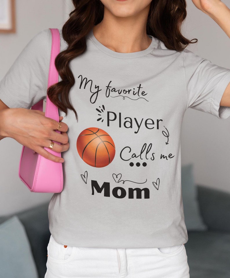Basketball Mom T-Shirt, Sports Mom Shirt, My Favorite Player Calls Me Mom Tee, Basketball Heart Design, Unisex TopBasketball Mom T-Shirt, Sports Mom Shirt, My Favorite Player Calls Me Mom Tee, Basketball Heart Design, Unisex Top