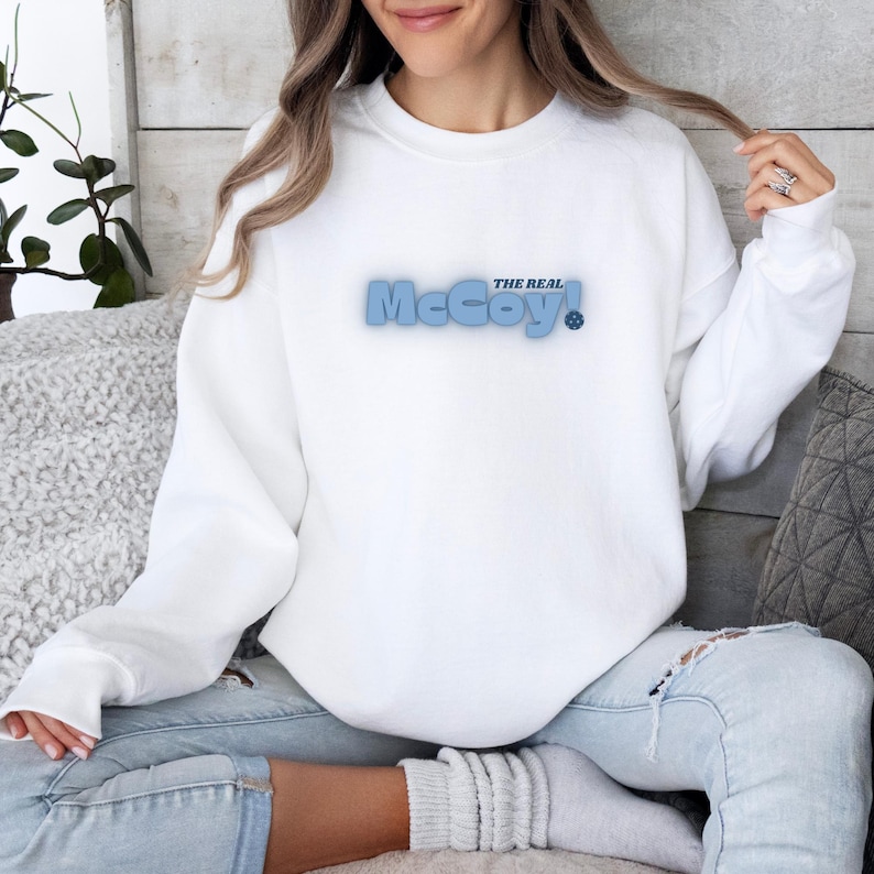 The Real McCoy Pickle Ball Sweatshirt, Trendy Pickleball Sweater, Cute Game Day Long Sleeve, Sporty Crew Neck Sweatshirts With Neck LabelThe Real McCoy Pickle Ball Sweatshirt, Trendy Pickleball Sweater, Cute Game Day Long Sleeve, Sporty Crew Neck Sweatshirts With Neck Label For Men And Women