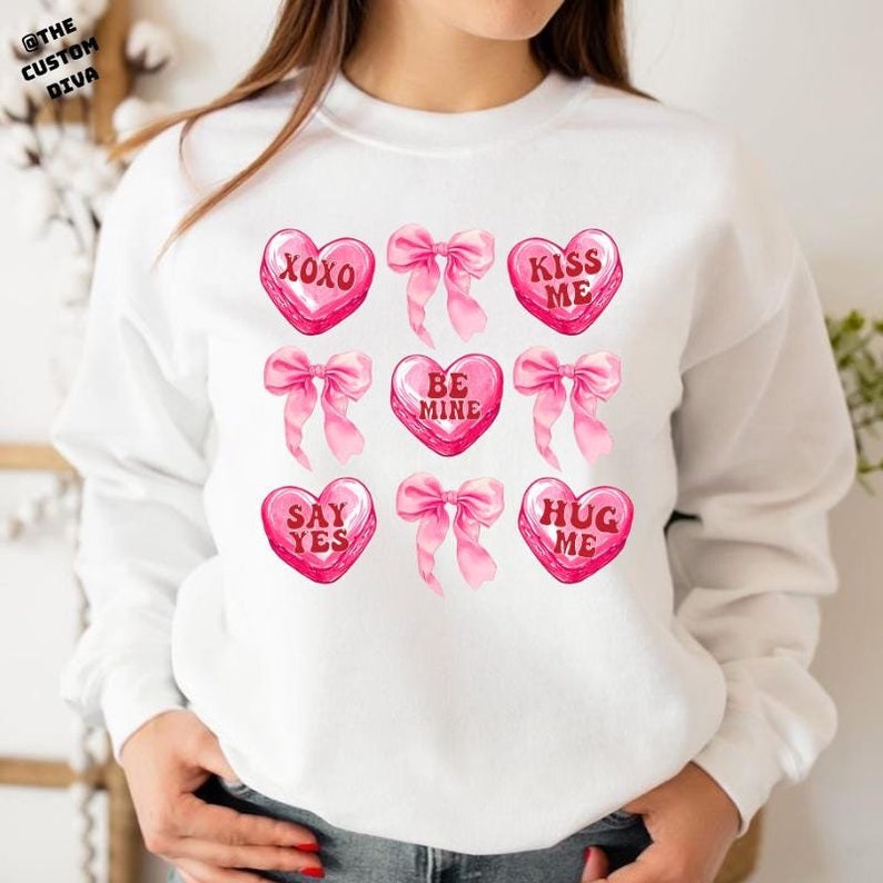 Pink Valentine Candy Heart Sweatshirt, XOXO Valentine Sweatshirt, Hugs and Kisses Valentine Sweatshirt, Valentine Coquette Bow Sweatshirt. For Men And Women
