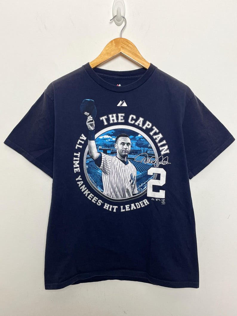 Vintage New York Yankees Derek Jeter The Captain #2 All Time Hits Leader MLB Baseball Pinstripe Graphic Tee Shirt (fits adult Medium) For Men And Women